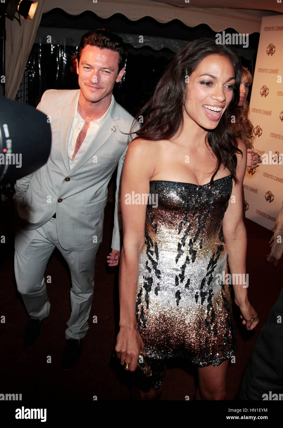 Luke Evans and Rosario Dawson leave the Roberto Cavalli party in Cannes, France on May 18, 2011. Photo by Francis Specker Stock Photo