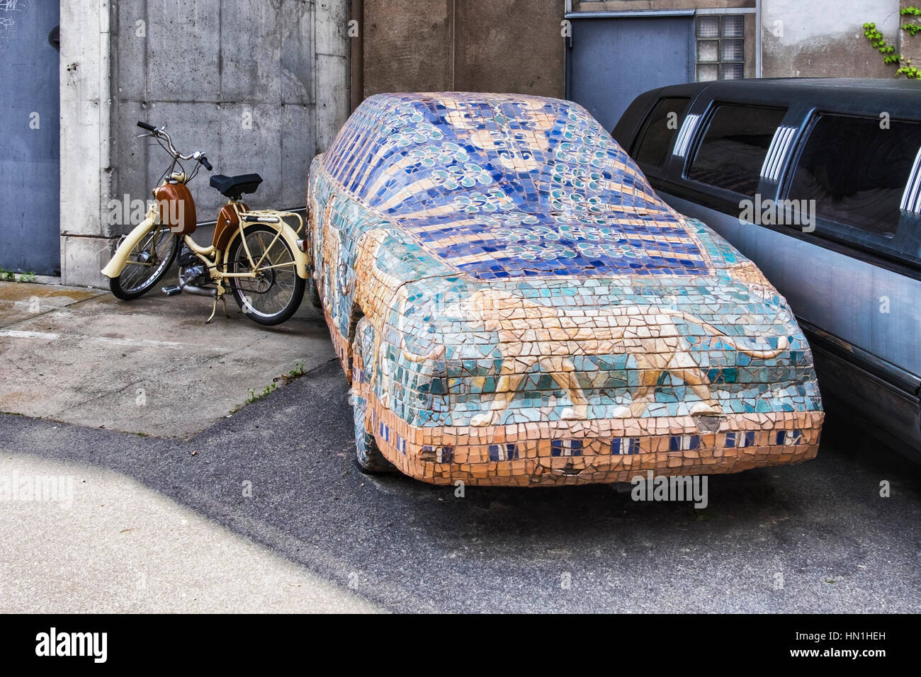 Berlin, Kreuzberg. Car covered and decorated with wildlife animal theme parked outside Sage restaurant Stock Photo