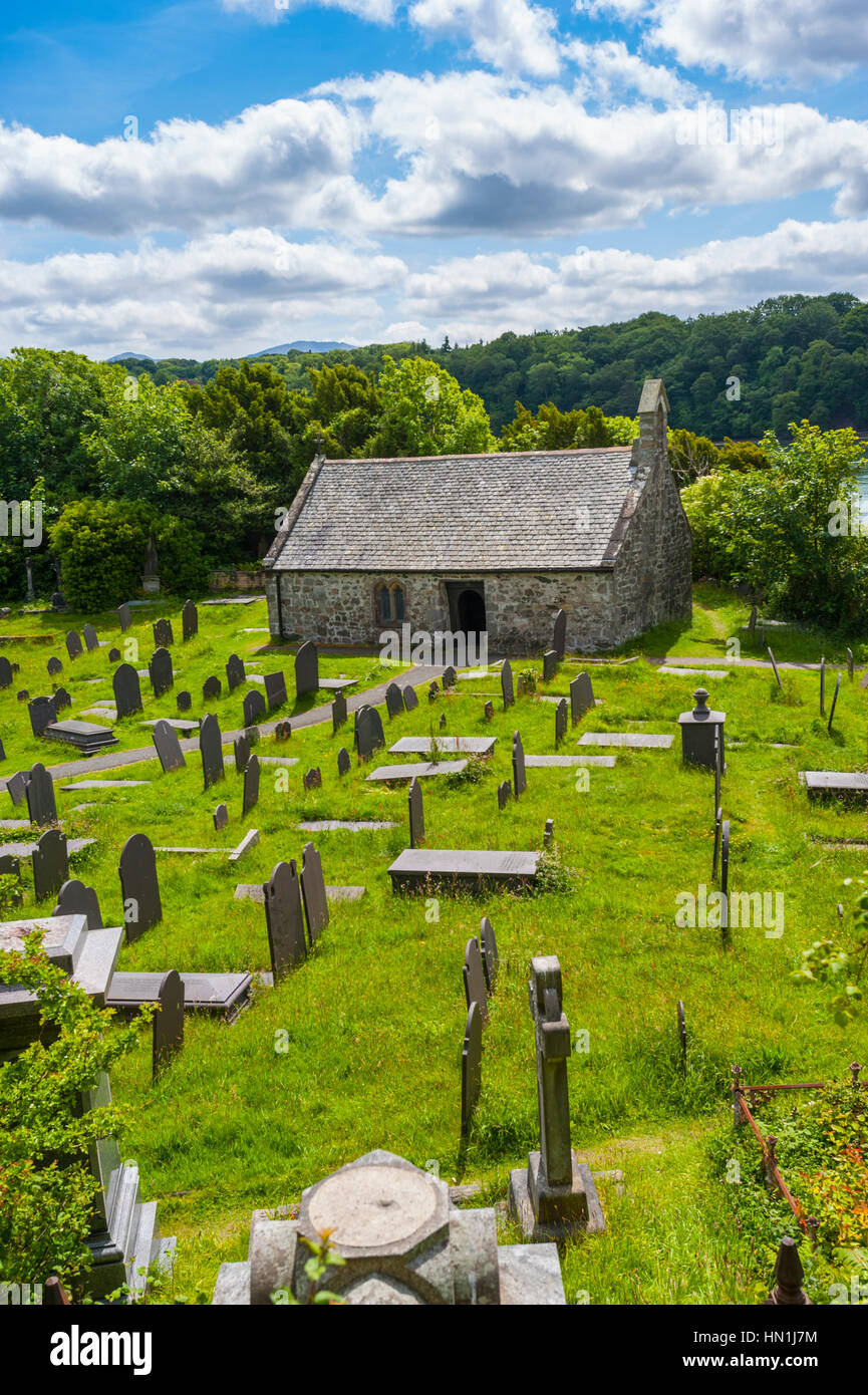 The graveyard of St tysilio church on church island in the menai straitghts at Menai bridge Anglesey Stock Photo