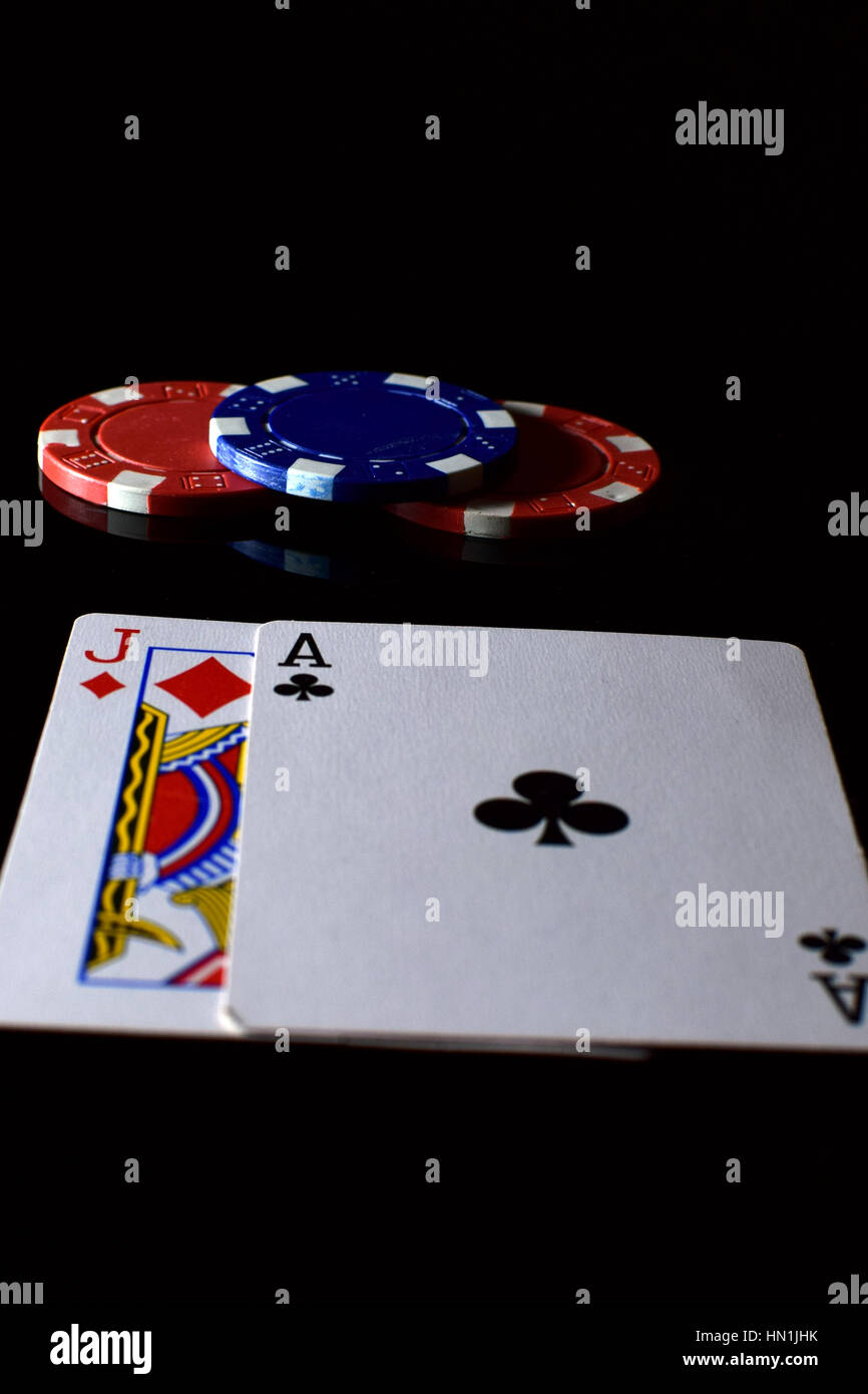 Blackjack. Playing cards ace and jack and betting chips on the table