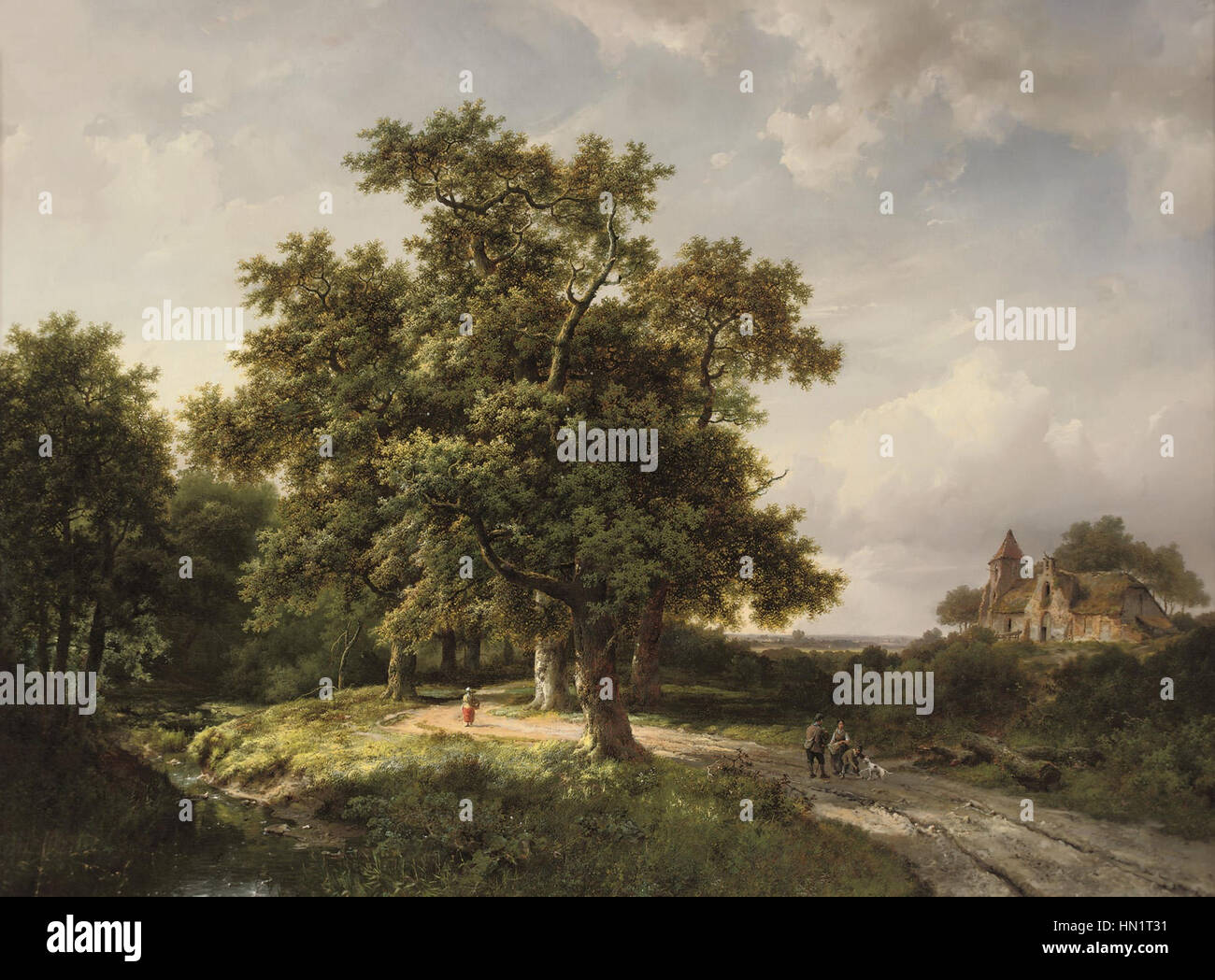 'Figures on a Forest Path' by Marinus Adrianus Koekkoek captures a serene moment with figures walking along a woodland path. The painting emphasizes the natural beauty of the forest, with detailed foliage and a tranquil atmosphere. Stock Photo