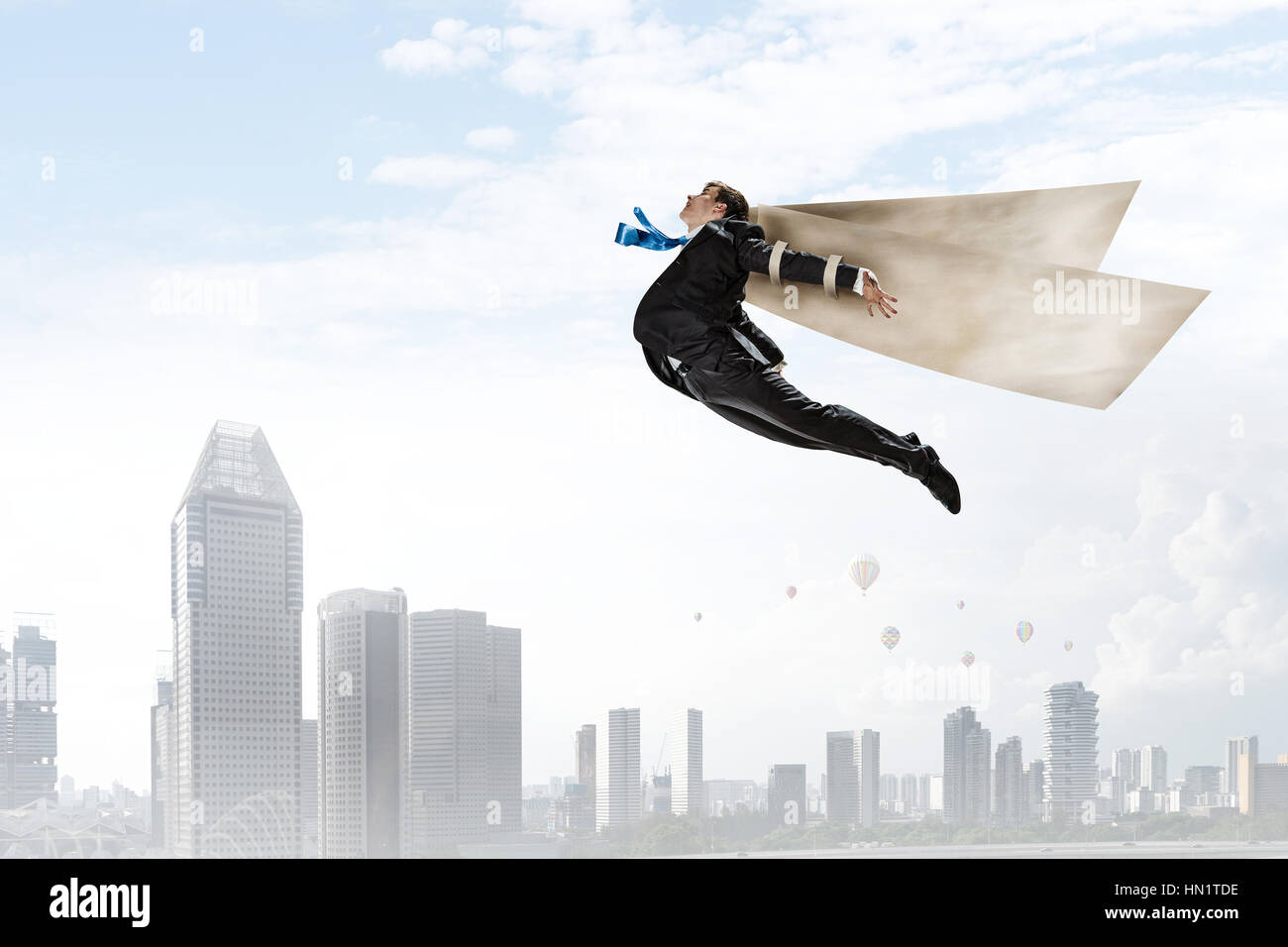 Young businessman with paper wings flying in sky Stock Photo - Alamy
