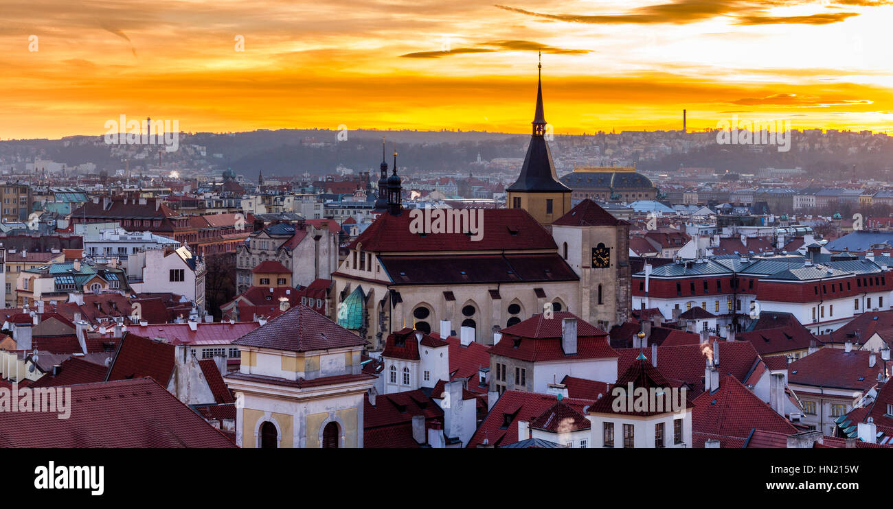 Amazing sunset and sky and fantastic view of the Old town square and Prague castle at dawn. Dramatic scene. Stock Photo