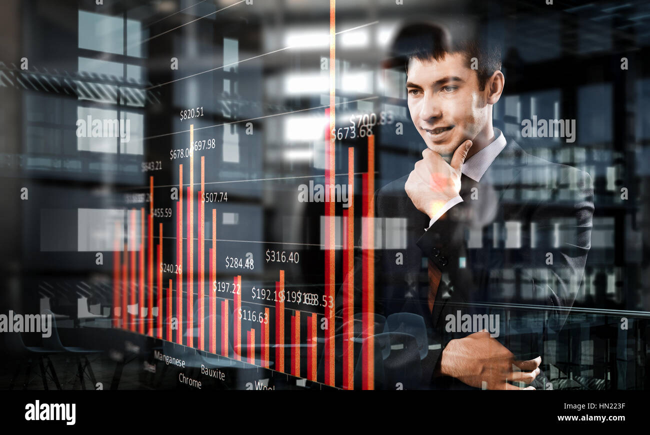 Exposure image of graphs and young thoughtful businessman looking away ...