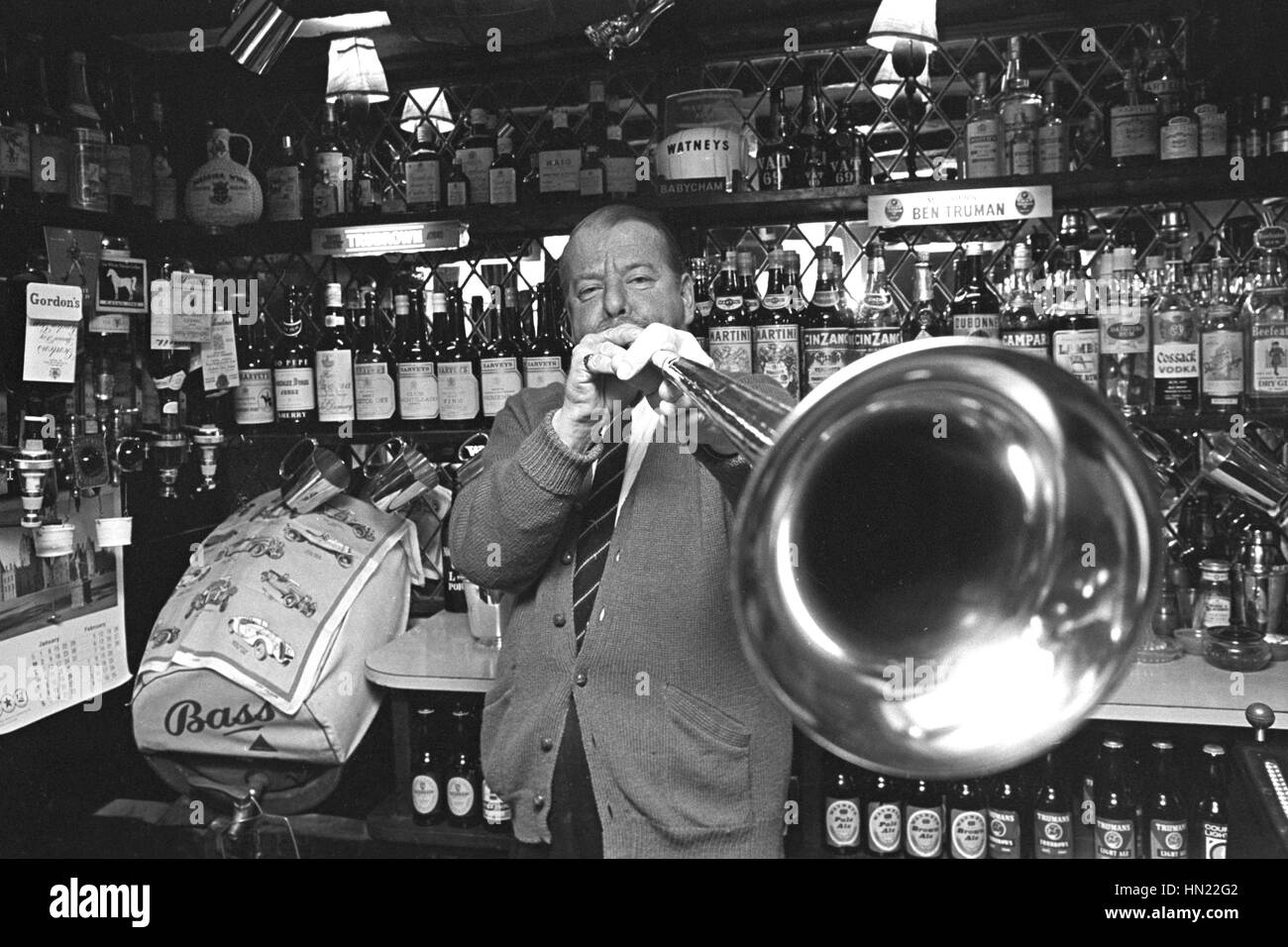 Christopher Wilson, 47, landlord of the Oxenham Arms, near Okehampton, Devon, tries out a 17th-century hunting horn, which is usually fixed to the roof of his inn. There is a grim legend associated with the instrument, that anyone who blows it will drop dead - and one of the pub's regulars did pass away the morning after he blew the horn for a bet. Mr Wilson is not convinced however, and often plays the instrument. Stock Photo