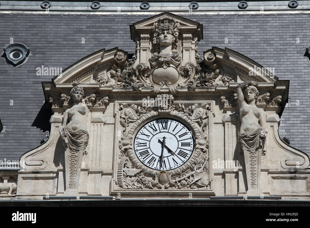 The clock on the facade of the Opéra-Théâtre de Clermont-Ferrand, Place de Jaude, Auvergne, France. Inaugurated 1894. Architect Jean Teillard. Stock Photo