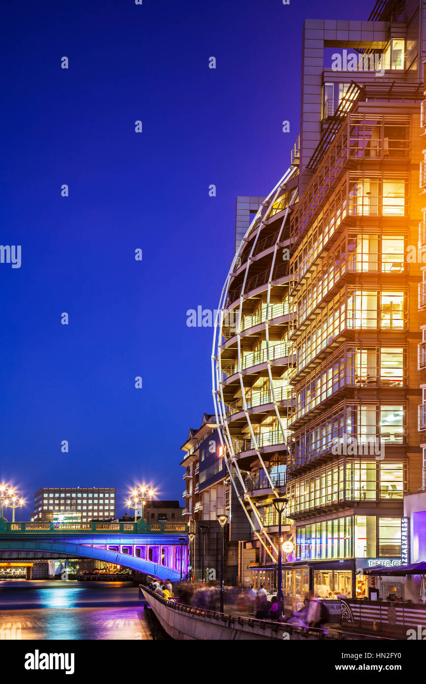 Part of Southwark Bridge and Bankside along the river Thames in London at night. Stock Photo