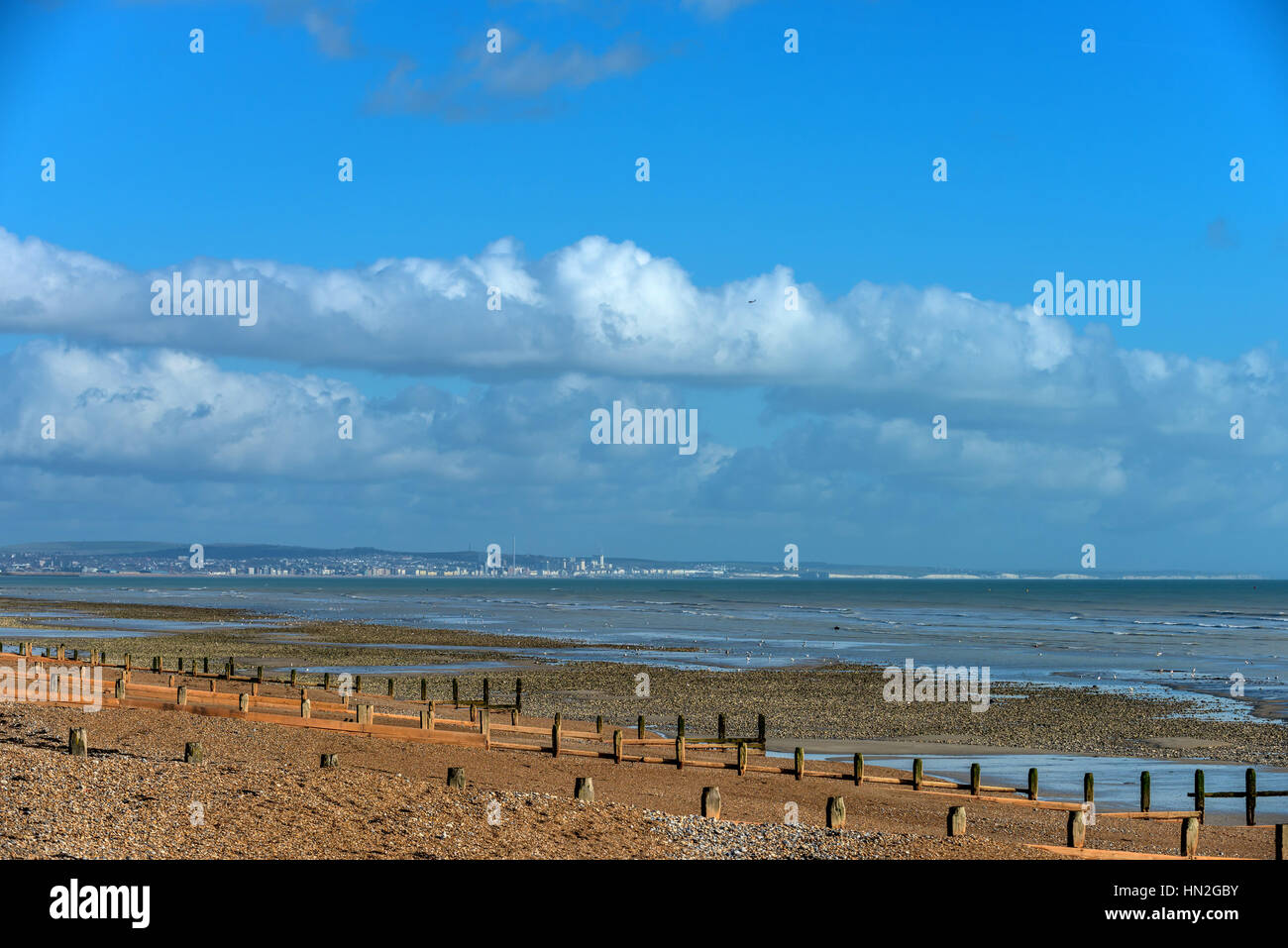 The view from Worthing beach across to Brighton and beyond Stock Photo