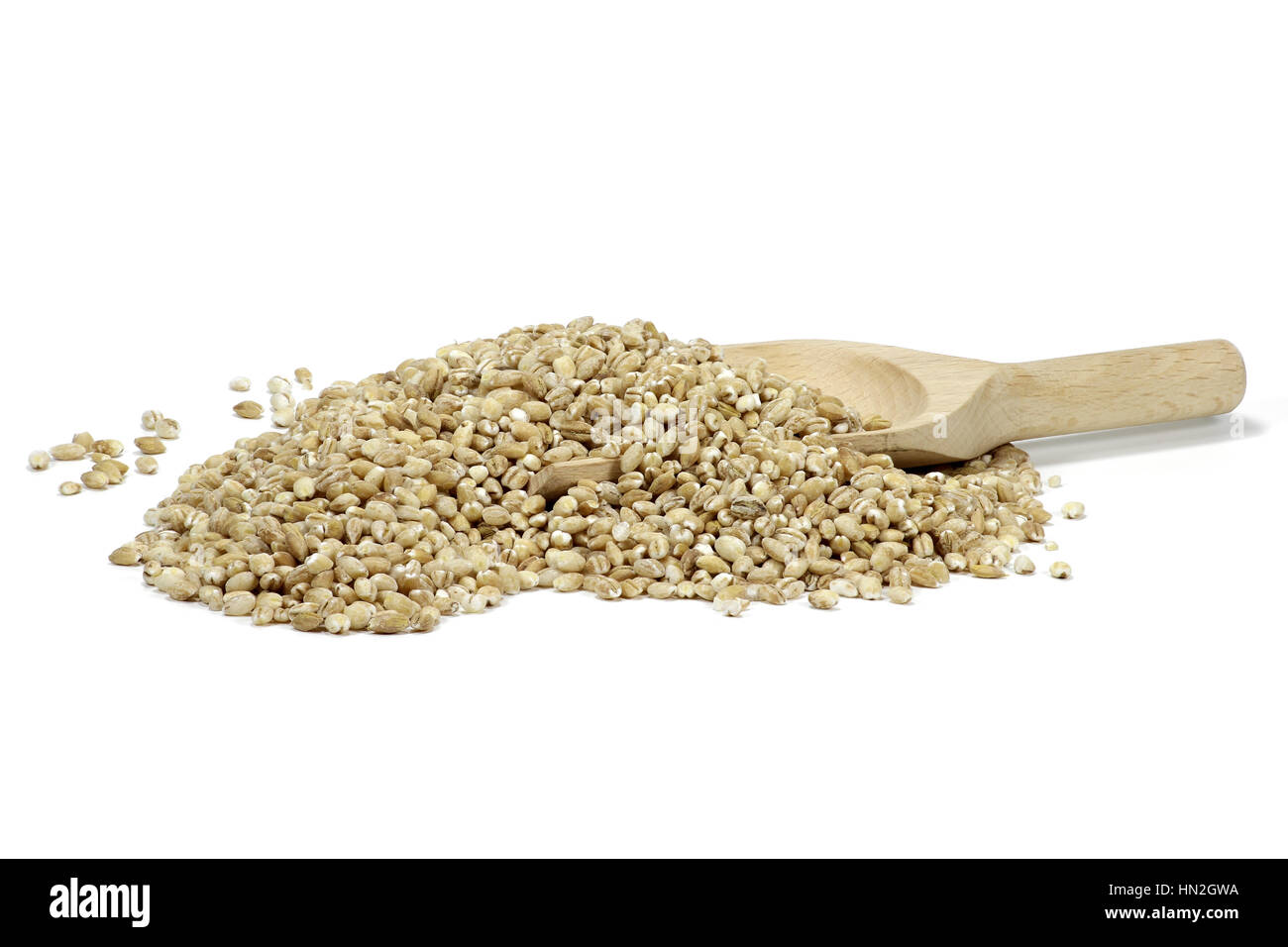wooden spoon with barley grains isolated on white background Stock Photo
