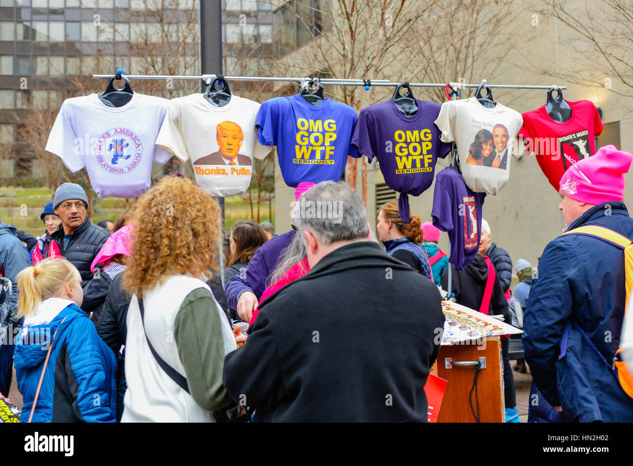 Protesters Using Shirts People pursue tee shirts for sale with street vendor on January 21 ...
