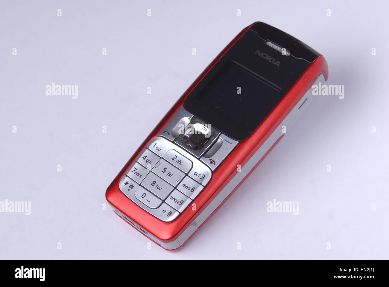 Red Nokia mobile phone on a white background Stock Photo