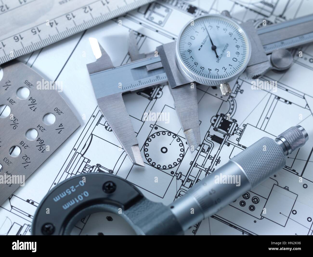 Drawing and measuring equipment on an engineering blue print Stock Photo Alamy