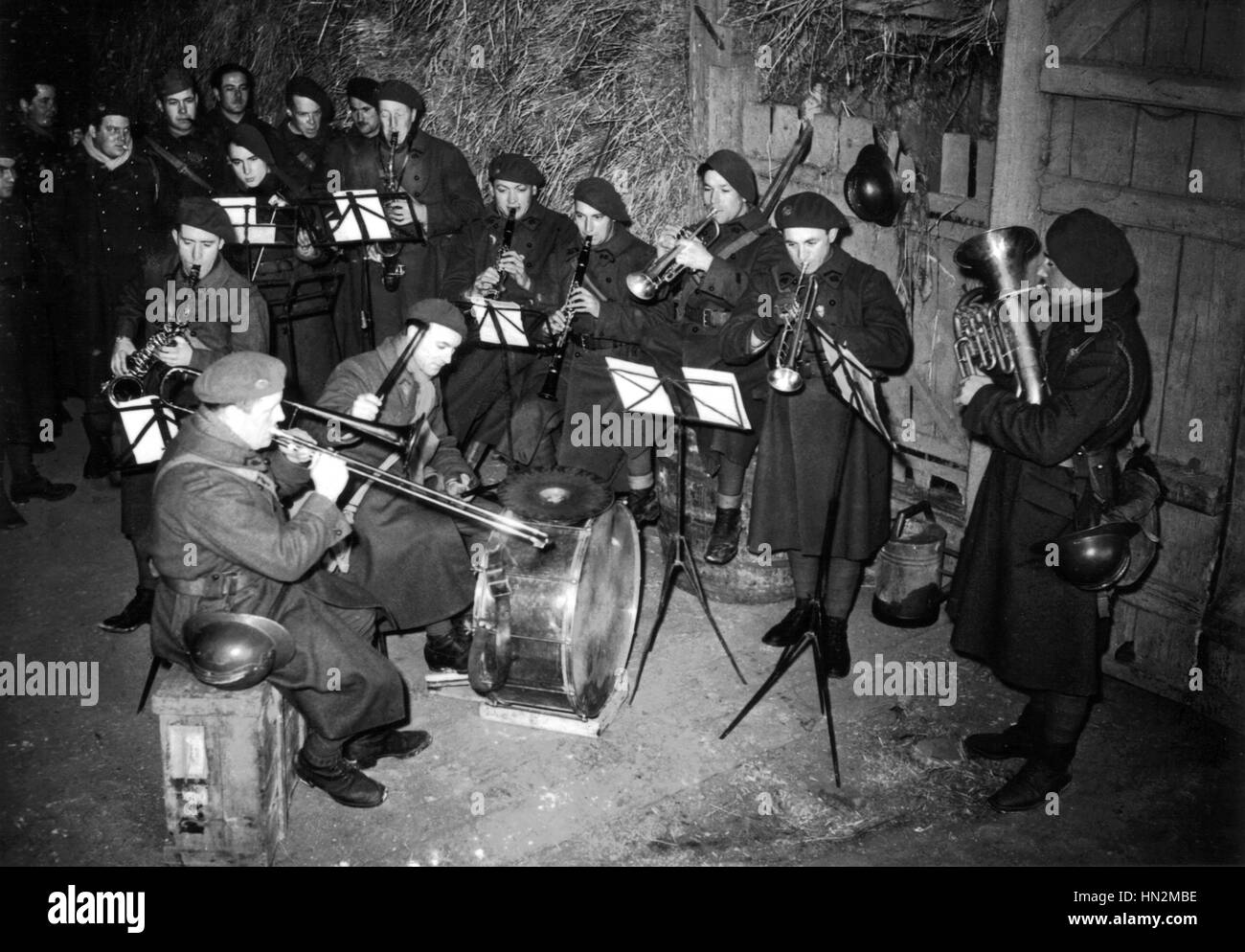 Jazz band set up in a barn to entertain soldiers  January 1940 France - World War II Stock Photo