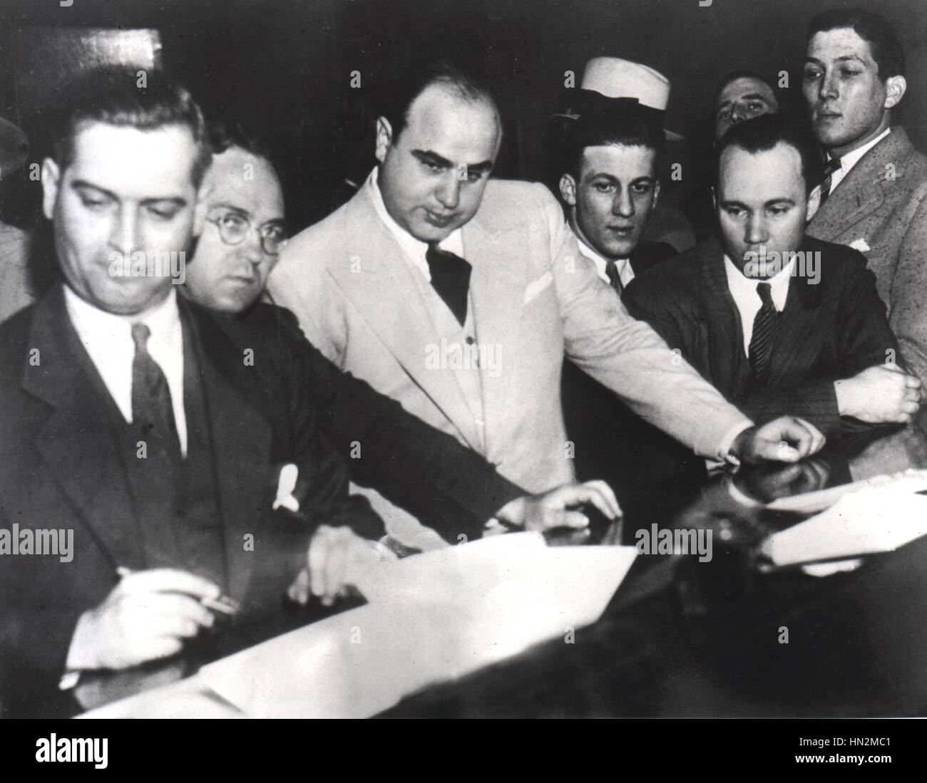 Al Capone signing Uncle Sam's Bail Bond (for the violation of the Prohibition laws) June 7, 1931 United States Stock Photo