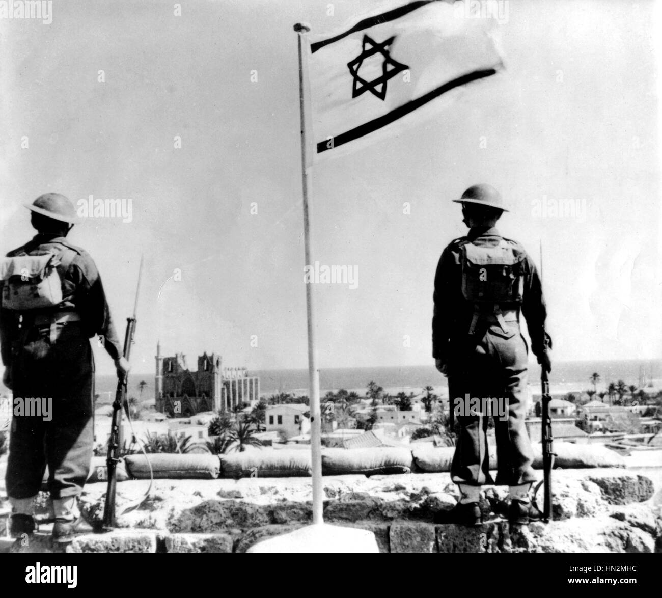 Jewish 'Foreign Legion' guards crusader ramparts in Cyprus. Two soldiers standing on wall alongside the Jewish National flag. c.1948 Washington, Library of Congress Stock Photo