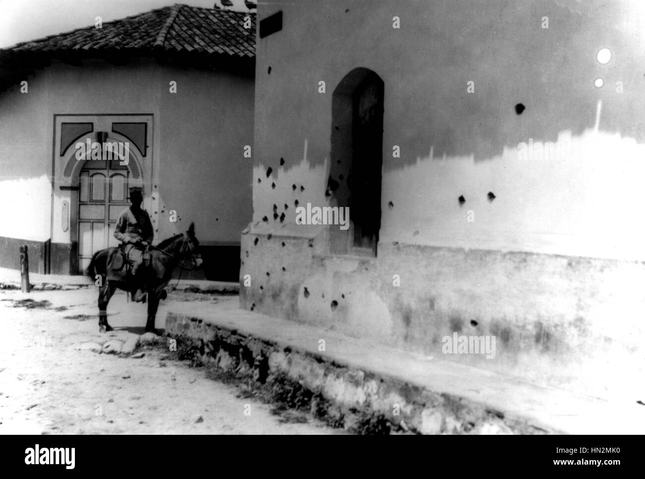 Wall pocked with bullet holes during machine gun fire by Sandino's rebel forces Around 1916-1920 Nicaragua Washington. National archives Stock Photo