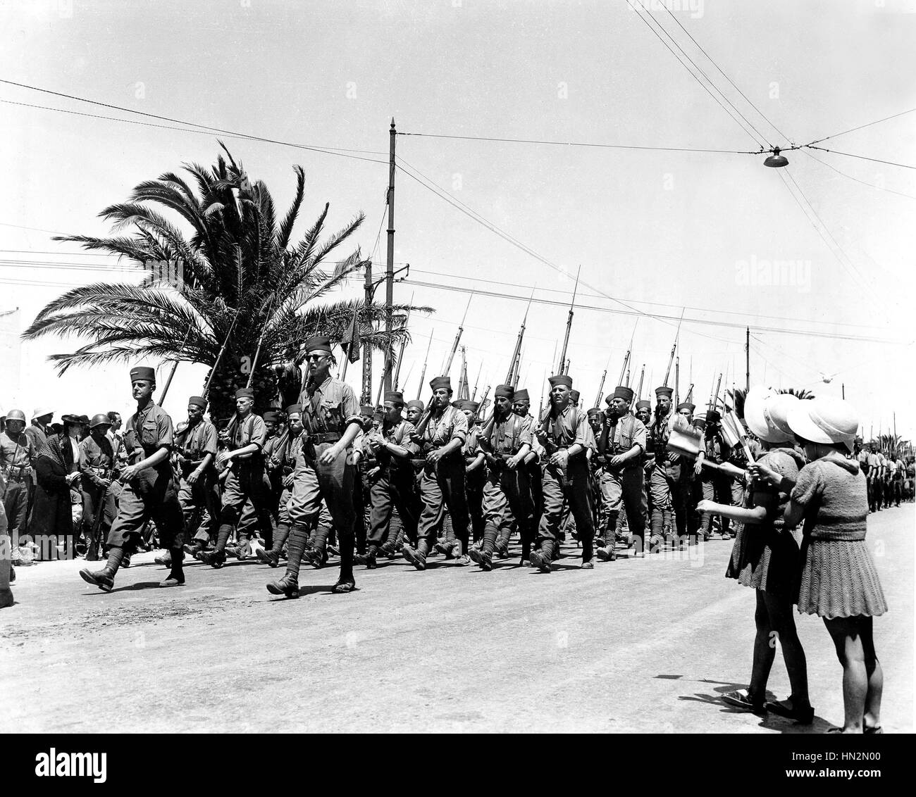 French children waving at colonial troops in Tunis  May 20, 943 Tunisia - World War II Washington, Library of Congress Stock Photo