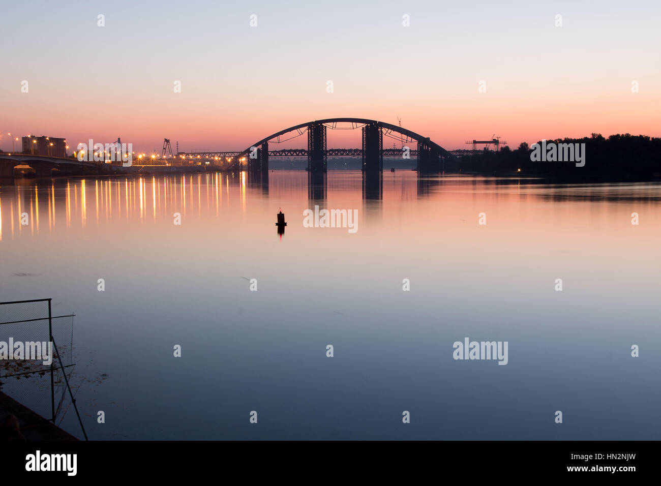 Bridge at dawn. The bridge across the river. Morning river Stock Photo ...