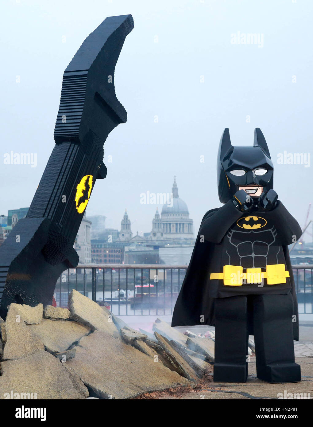 EDITORIAL USE ONLY A LEGO Batman character visits a 4 metre long Batarang  made from 35,000 LEGO bricks as it goes on display today at Observation  point on London's Southbank to celebrate