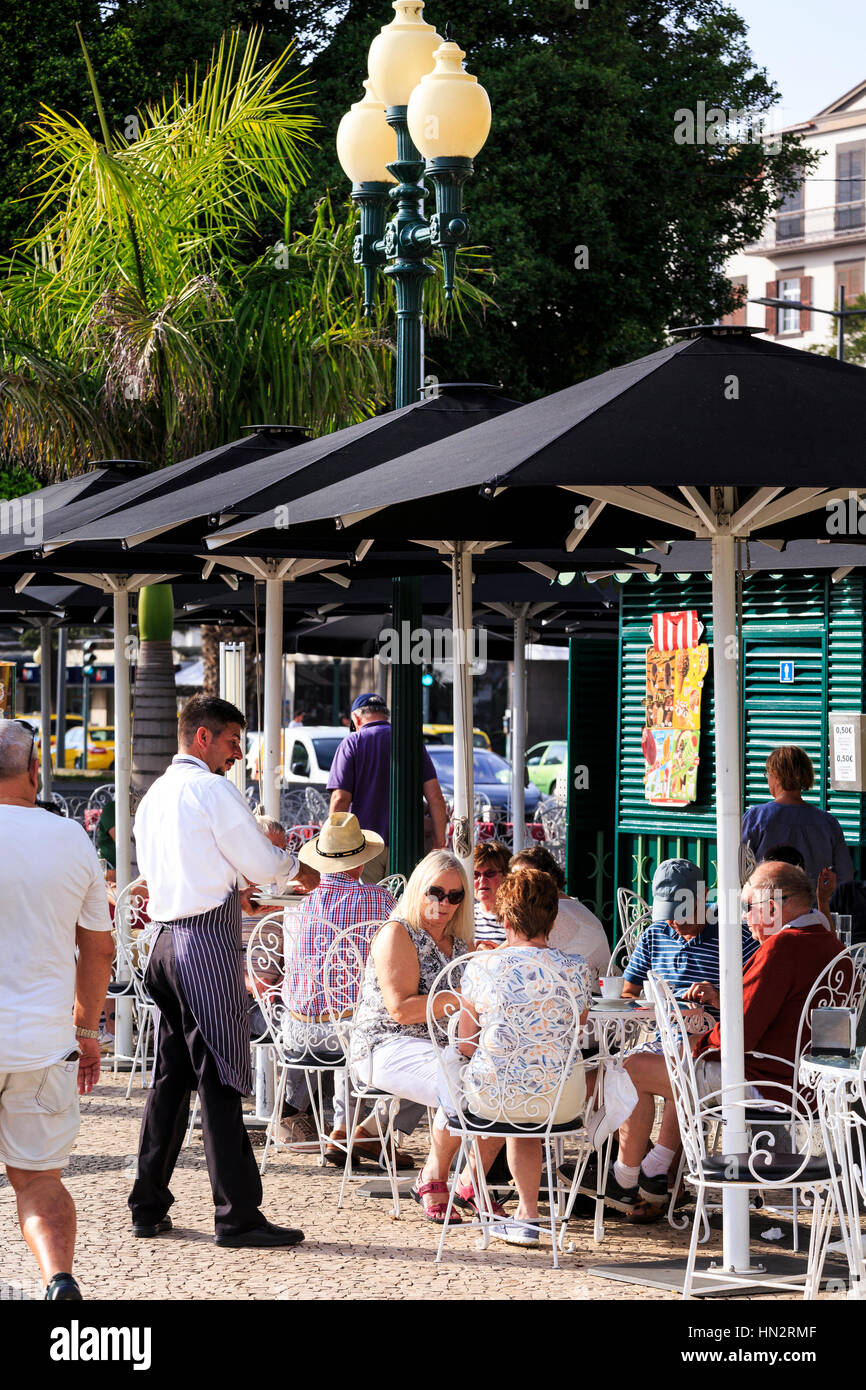 seafront promenade cafe with waiter, Funchal, Madeira Stock Photo