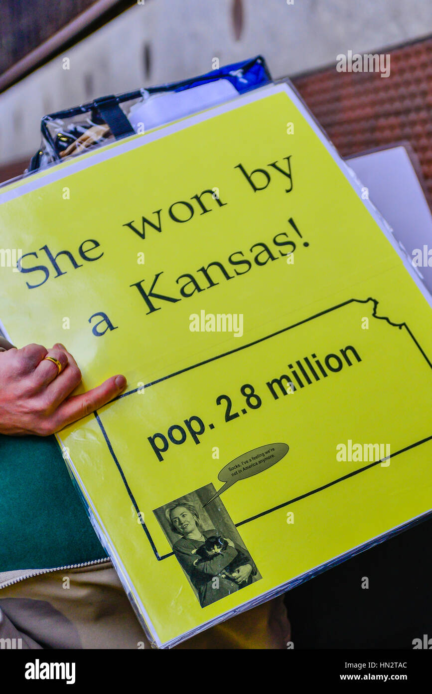 Sign reads 'She won by a Kansas?' in reference to Hillary Clinton's 2.8 million more popular votes see at Women's March on Washington, DC Stock Photo