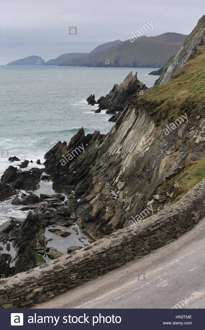 Ireland in all its beauty:Ireland in all its beauty as the Atlantic Ocean waves crash on rocks near the Great Blasket Island off the coast of Kerry an Stock Photo