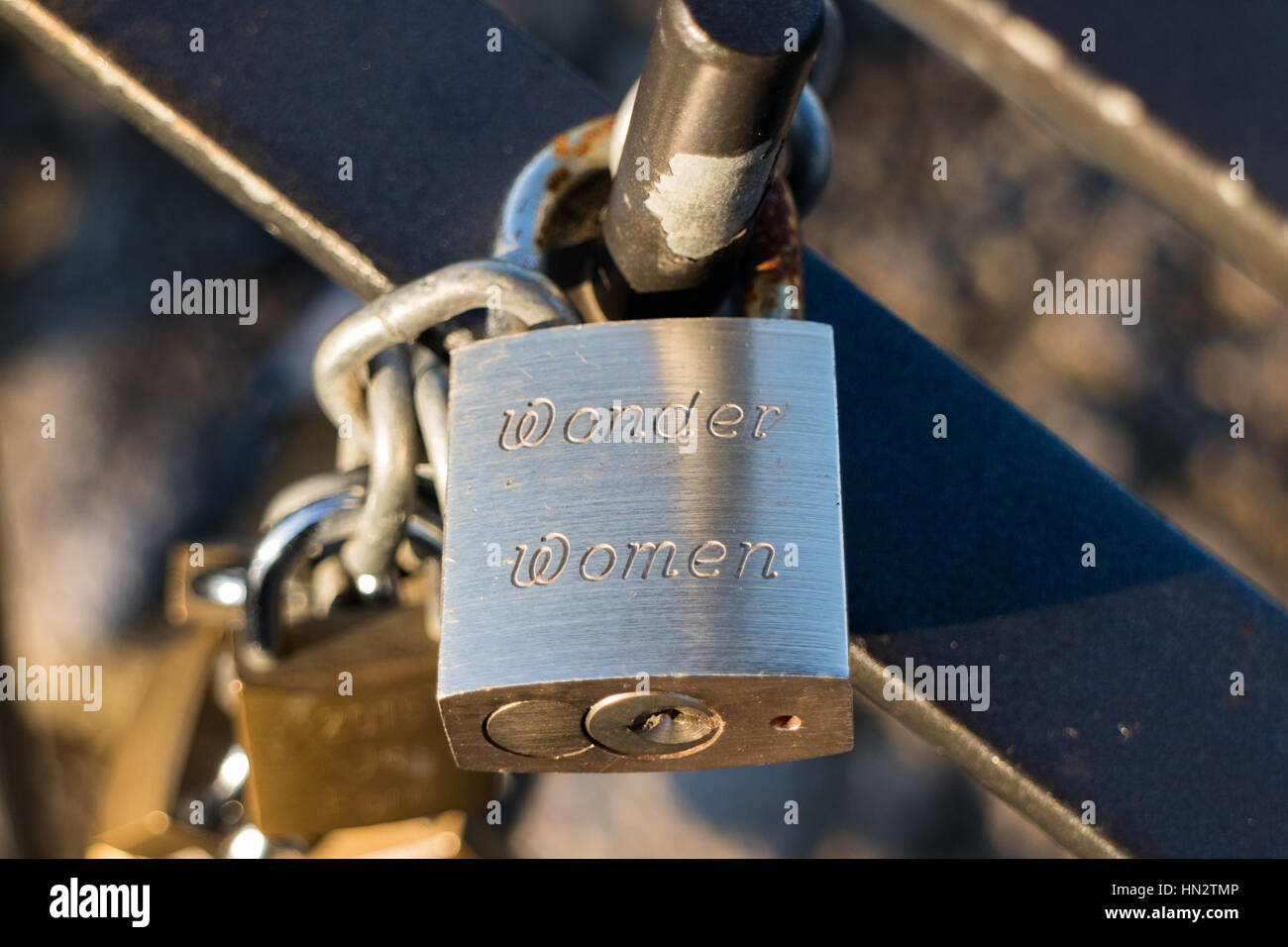 A padlock attached to railings with Wonder Women engraved Stock Photo