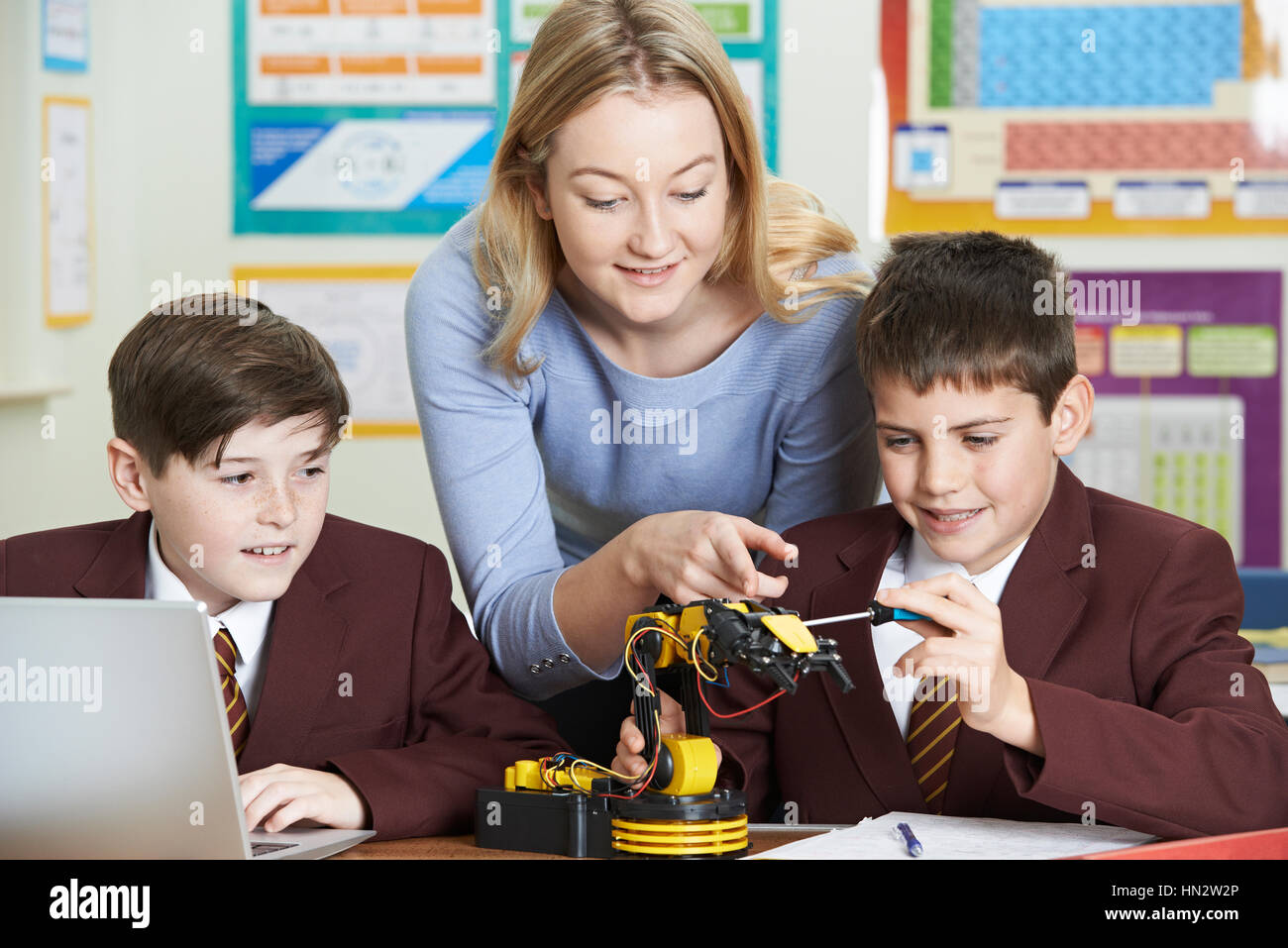 Teacher With Pupils In Science Lesson Studying Robotics Stock Photo