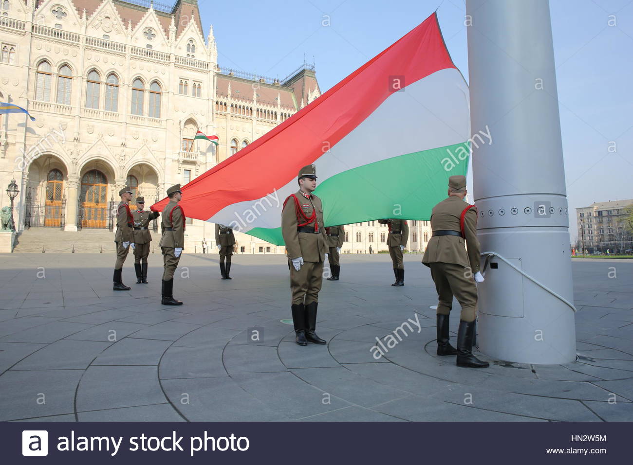 Hungarian soldiers perform a flag ceremony at the houses of parliament in Budapest Stock Photo