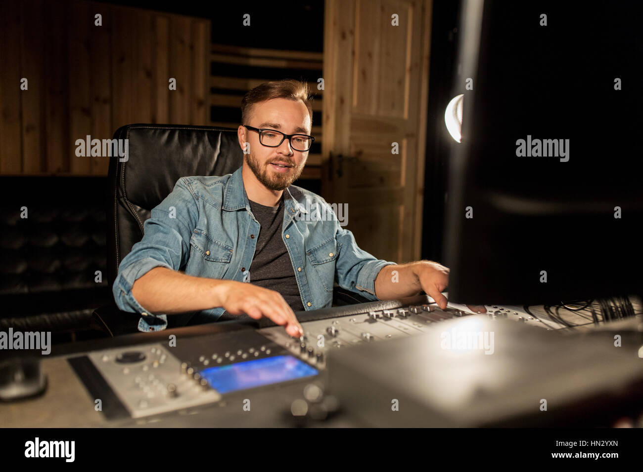 man at mixing console in music recording studio Stock Photo - Alamy