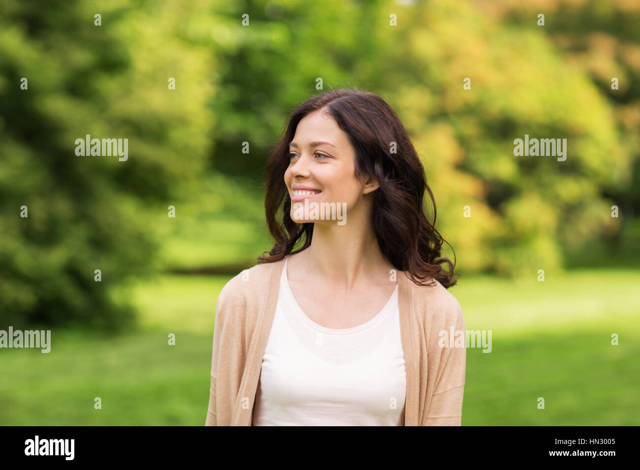beautiful happy young woman in summer park Stock Photo - Alamy