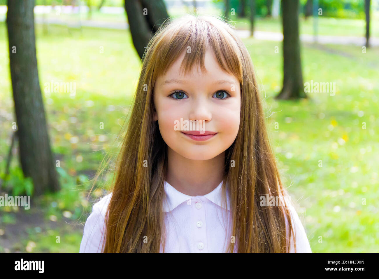 Photo of cute girl with long hair Stock Photo - Alamy