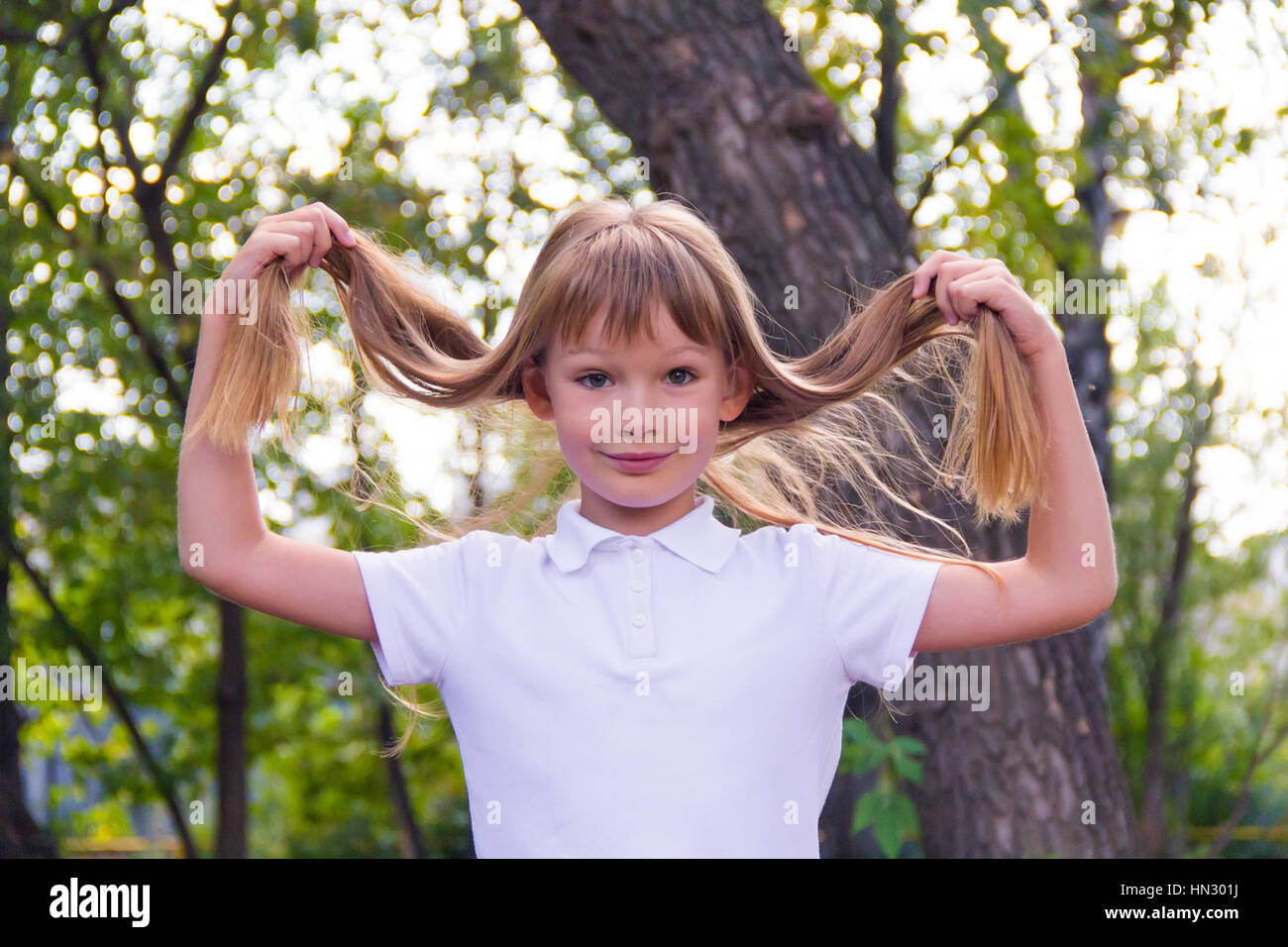 Photo of cute girl with long hair Stock Photo - Alamy