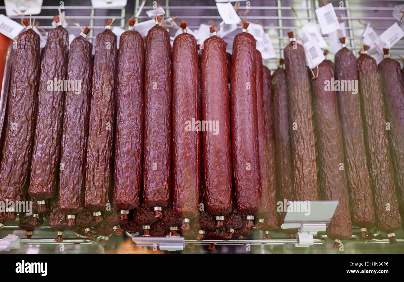 salami sausage at grocery store stall Stock Photo Alamy