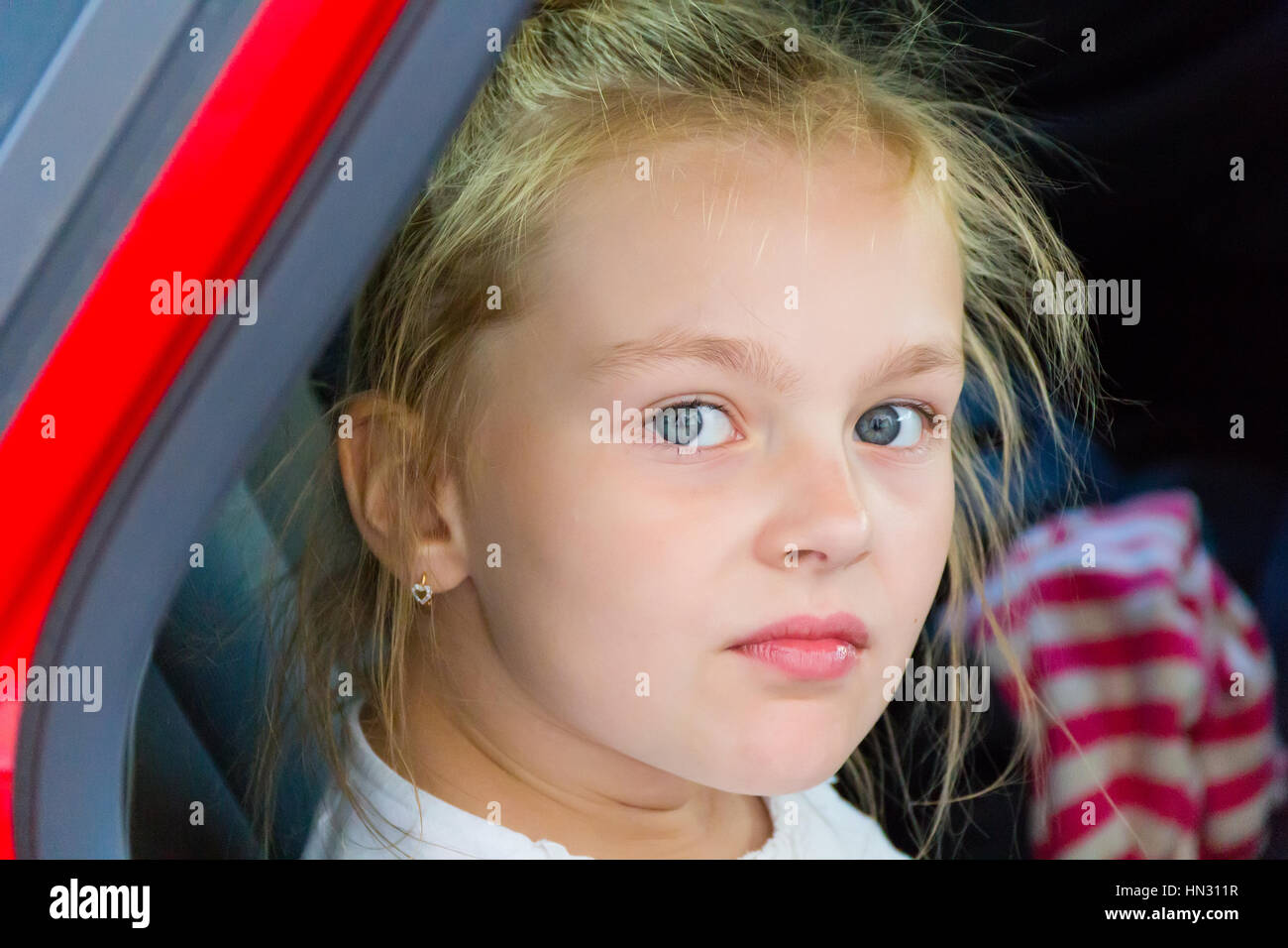 Cute girl with blond long hair and blue eyes Stock Photo - Alamy