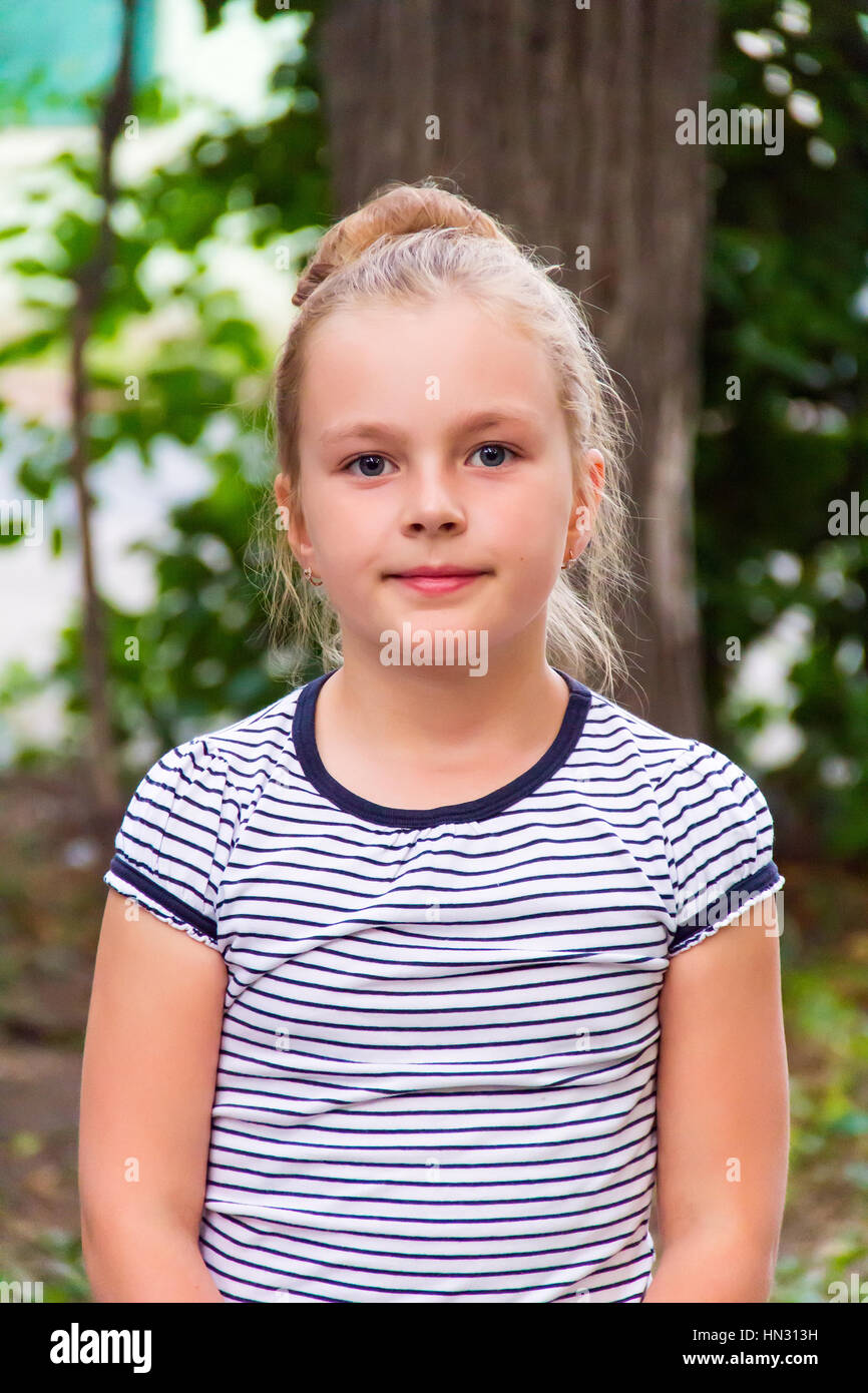 Cute girl with blond long hair and blue eyes Stock Photo - Alamy