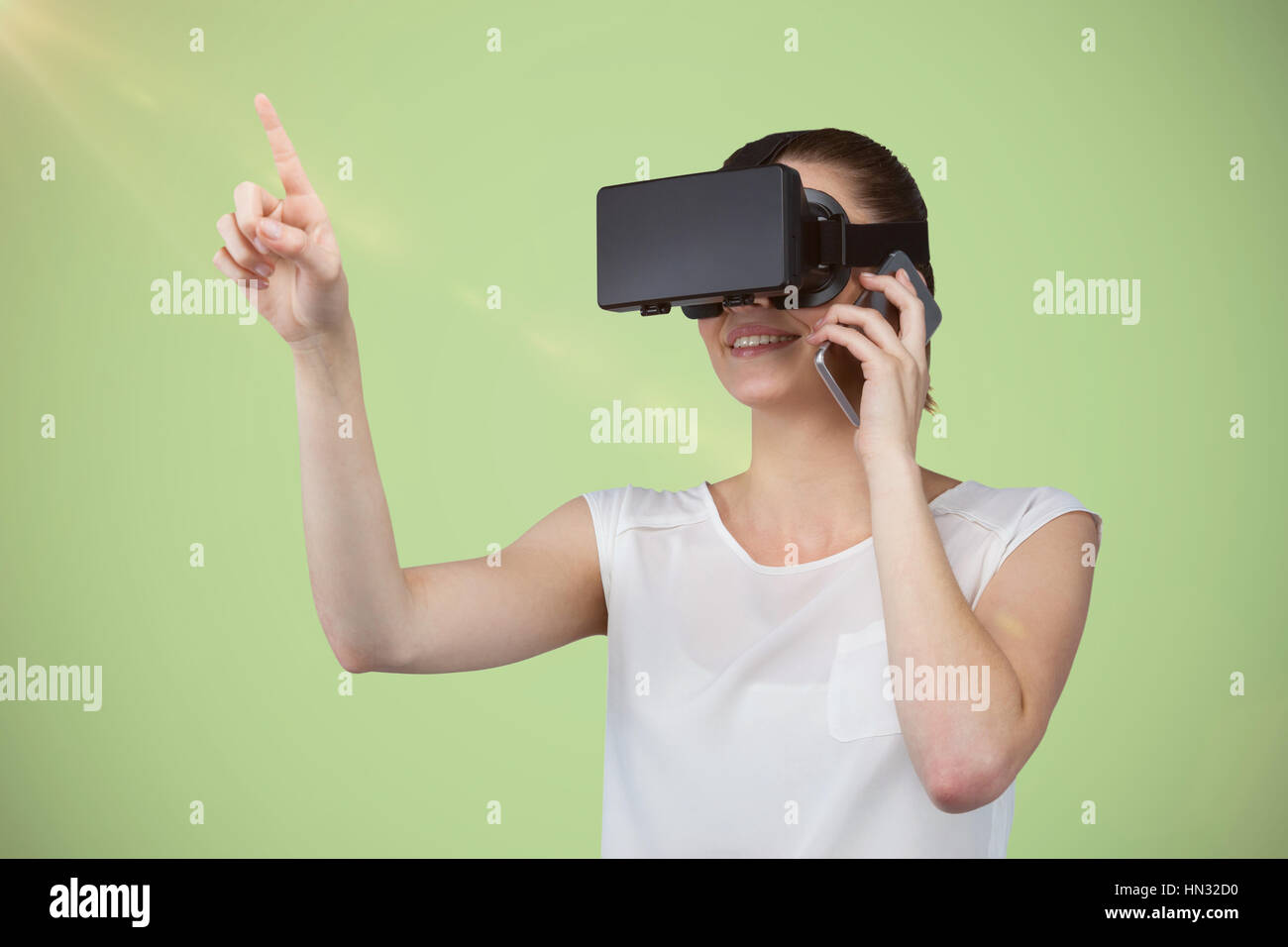 Beautiful woman gesturing while suing virtual reality headset and ...