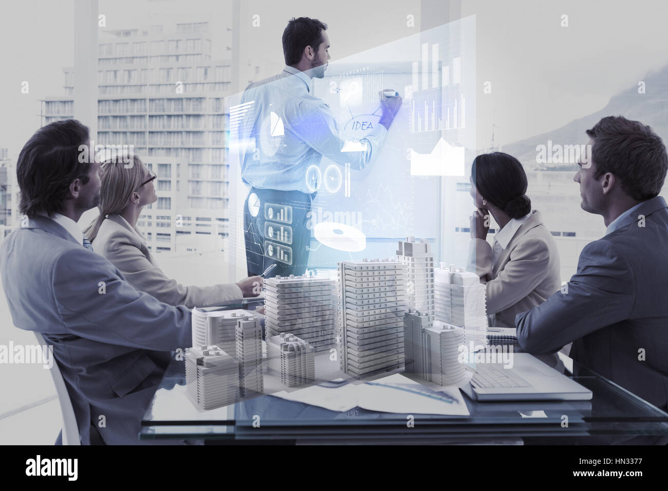 Skycrapers against composite image of business people and technology interface Stock Photo