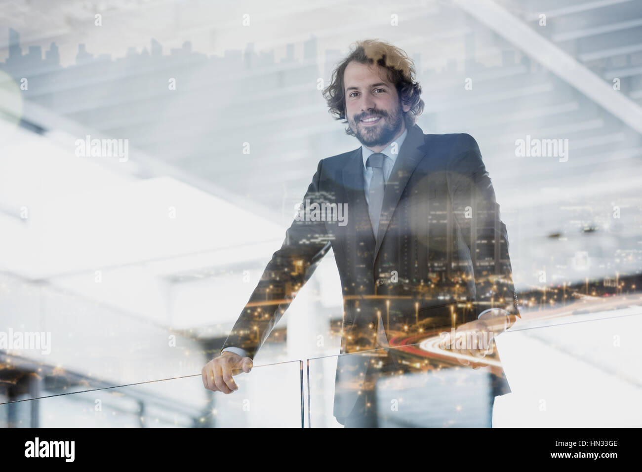 Portrait of happy businessman standing in office Stock Photo - Alamy