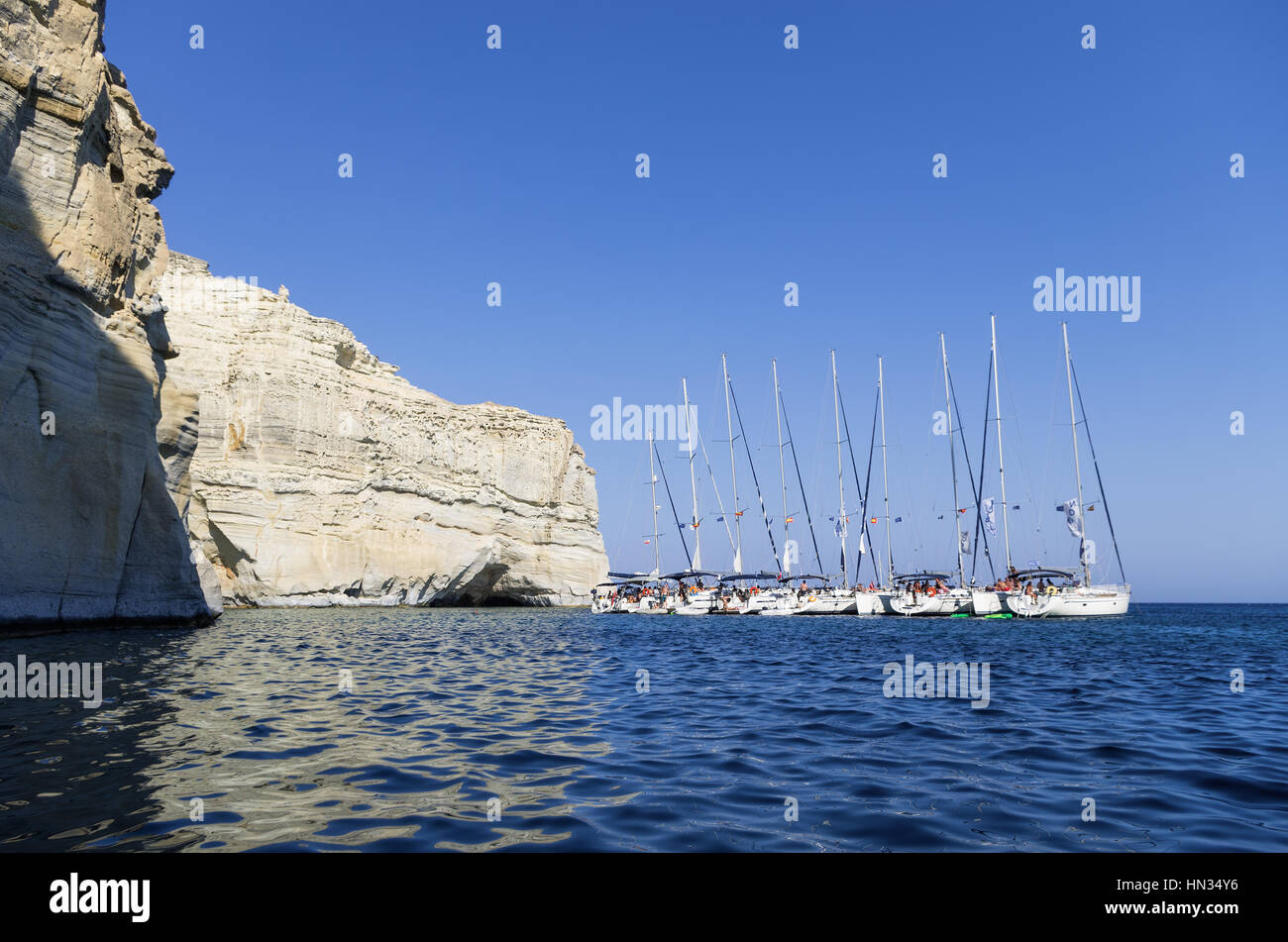 Sailing yachts anchored in a gulf in Milos island, Cyclades, Greece