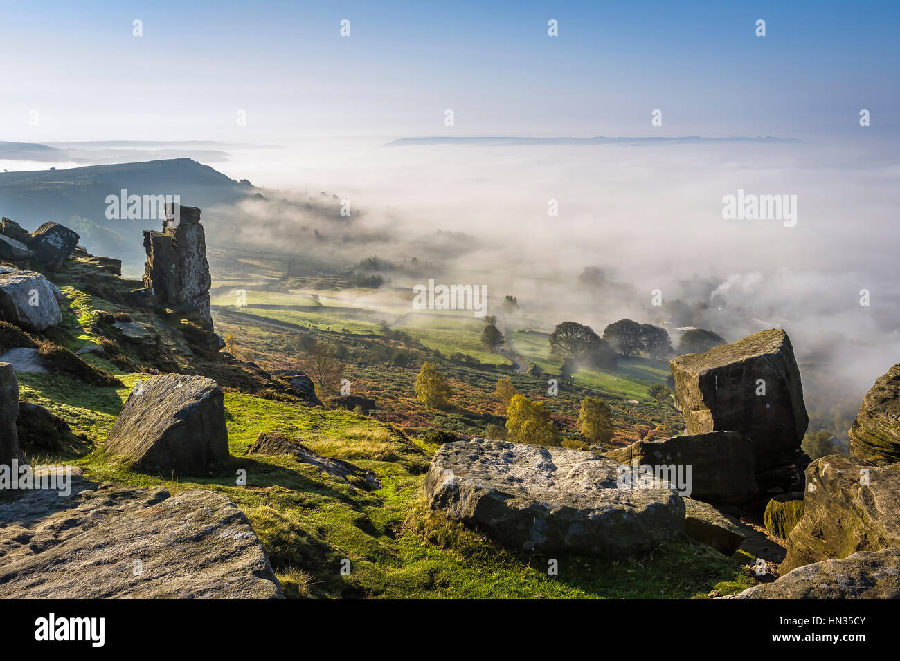Part finished millstones lie abandoned at the top of Curbar Edge in Derbyshire. Stock Photo
