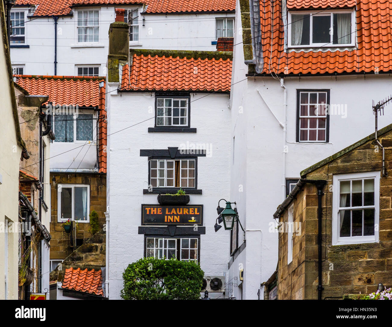 Tightly packed buildings around Staithes harbour. Stock Photo
