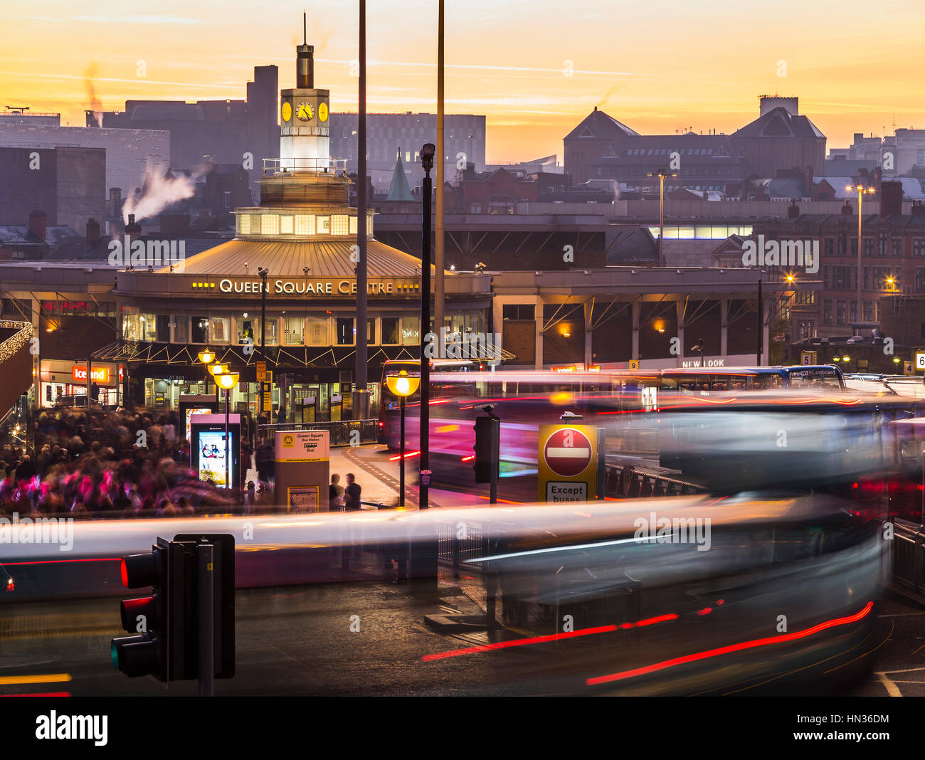 Buses swing into Queens Square station in the heart of Liverpool during the Black Friday weekend. Stock Photo