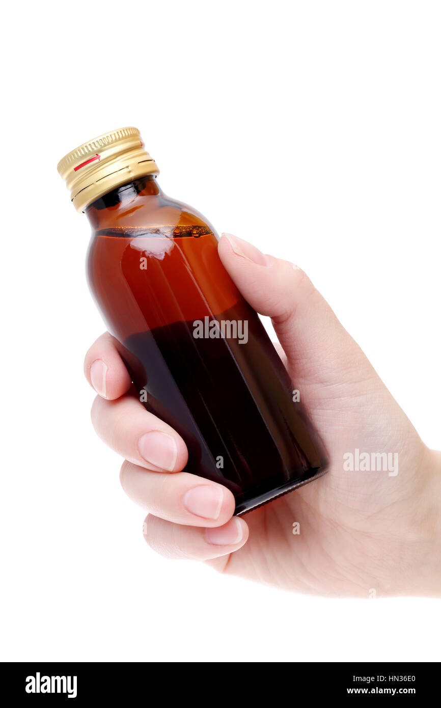 Hand holding brown medicine bottle isolated on white background Stock Photo