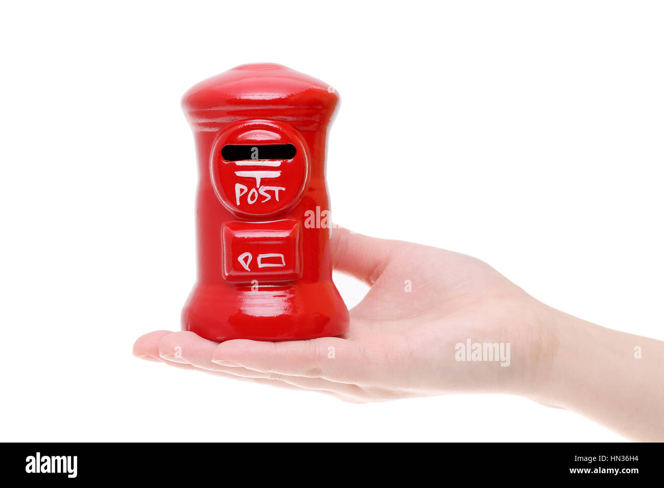 red toy post box on the hand isolated on white background Stock Photo