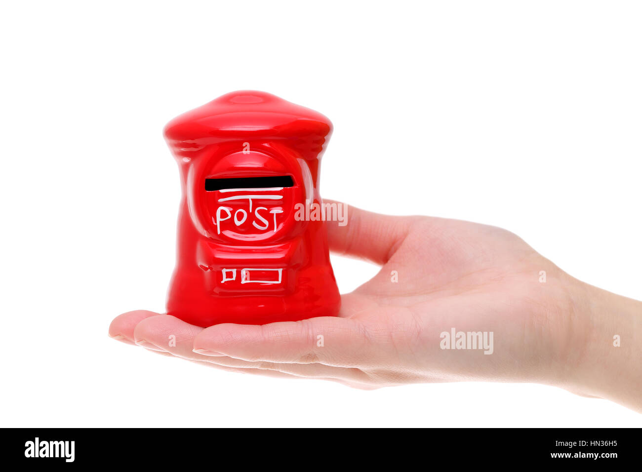 red toy post box on the hand isolated on white background Stock Photo