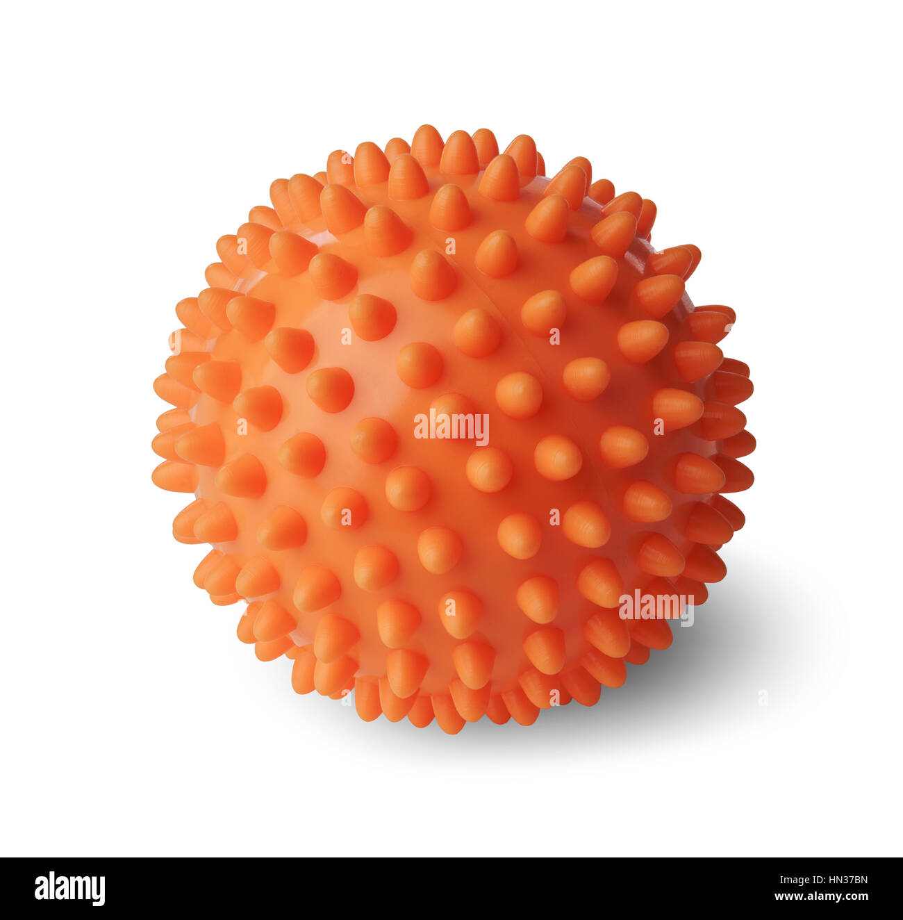 Spiny plastic orange massage ball isolated on white background Stock Photo