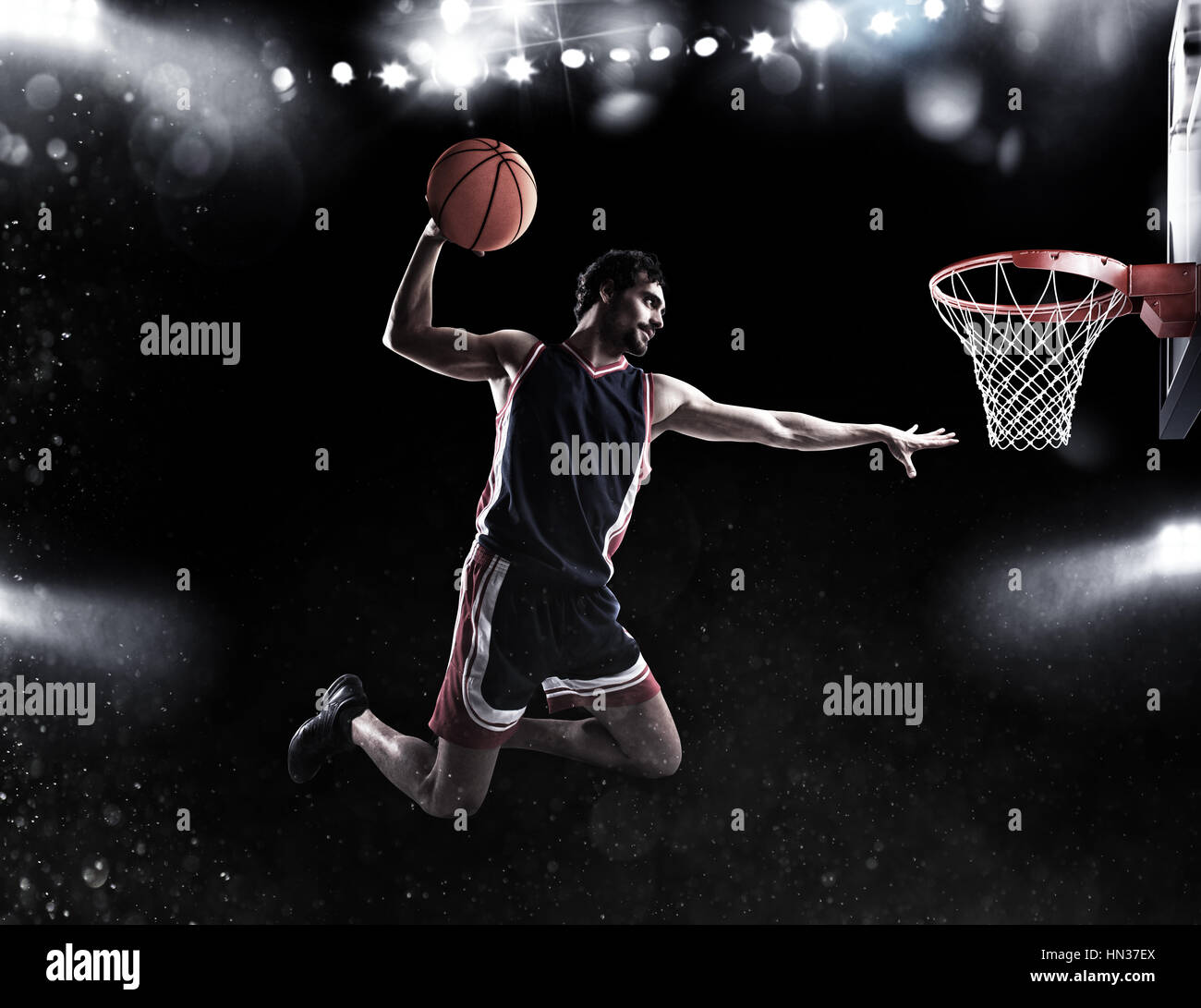 Basket player throws the ball at the stadium Stock Photo Alamy