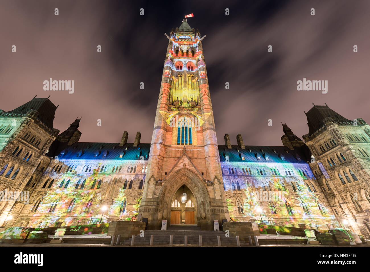 Winter holiday light show projected at night on the Canadian House of Parliament to celebrate the 150th Anniversary of Confederation of Canada Stock Photo