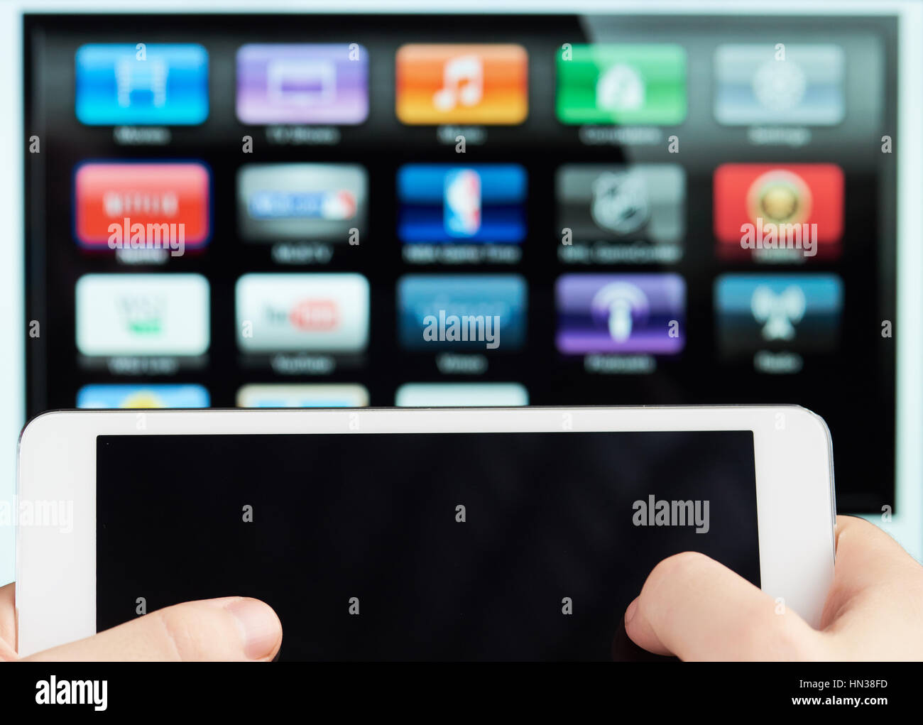 tablet connect to smart tv as remote close up Stock Photo